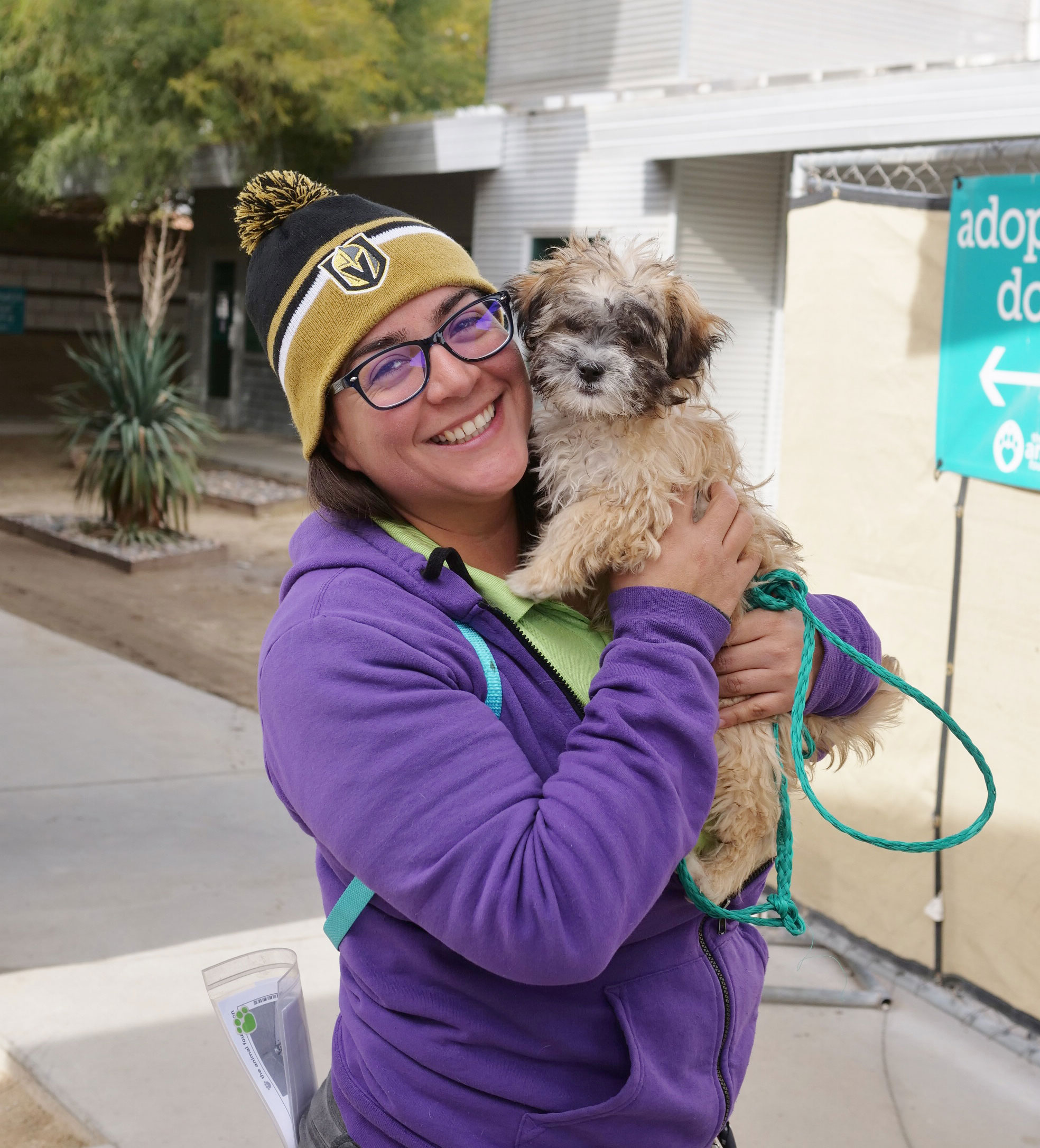 girl with fluffy dog at The Animal Foundation